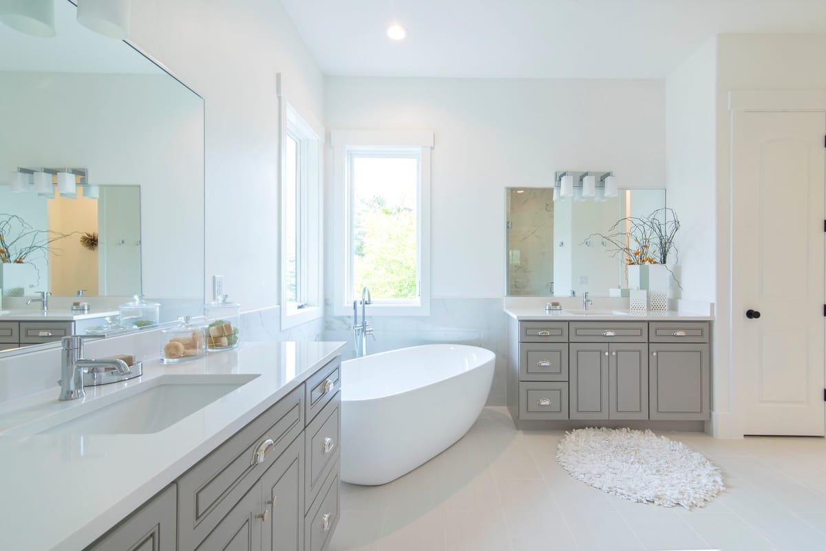 A main bathroom with a freestanding tub and a double vanity