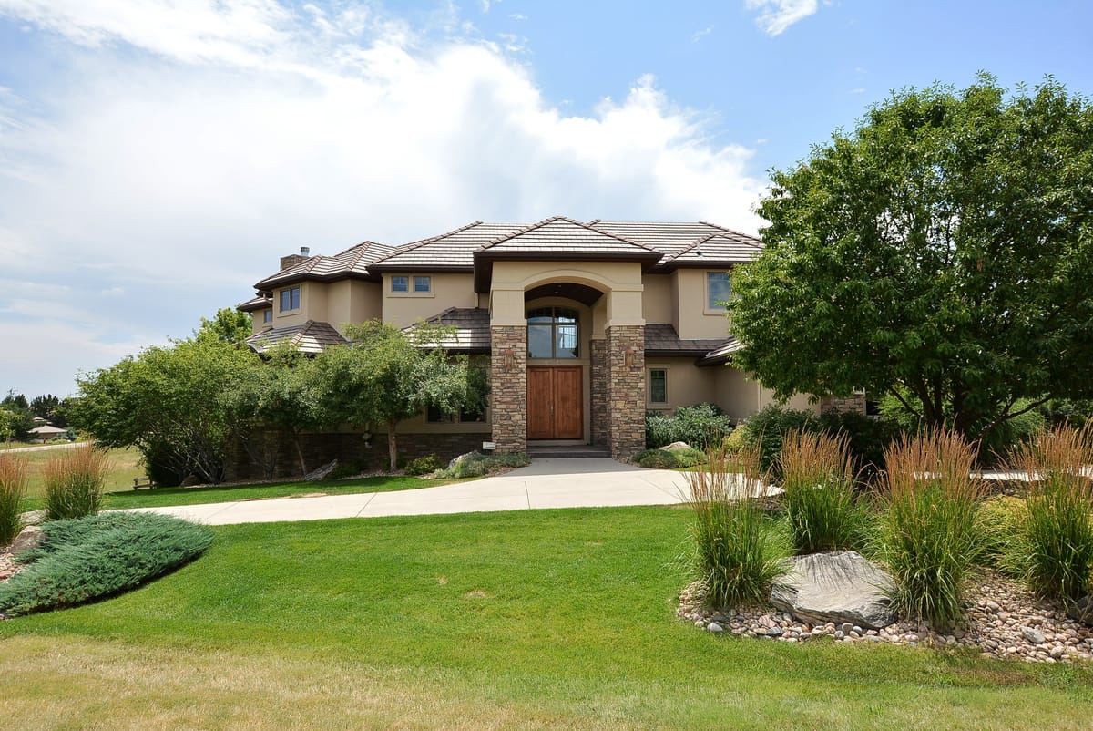 The home seen from the side, with ornamental grasses in the foreground