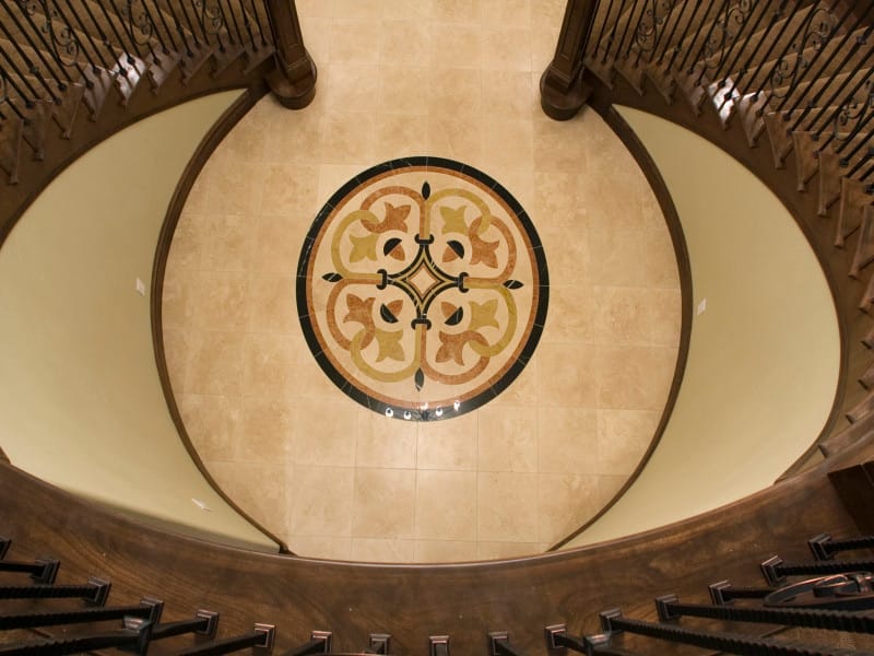 A domed ceiling with a decorative iron medallion