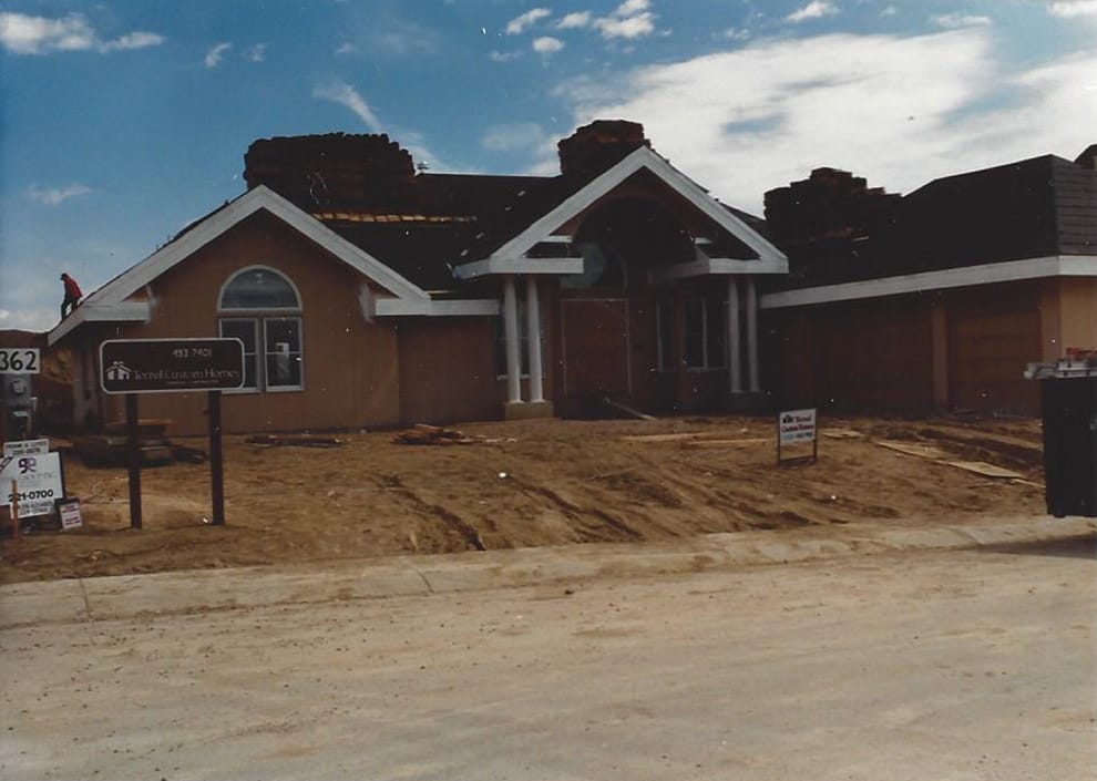 A house under construction on a bare lot, entered in the 1995 Parade of Homes